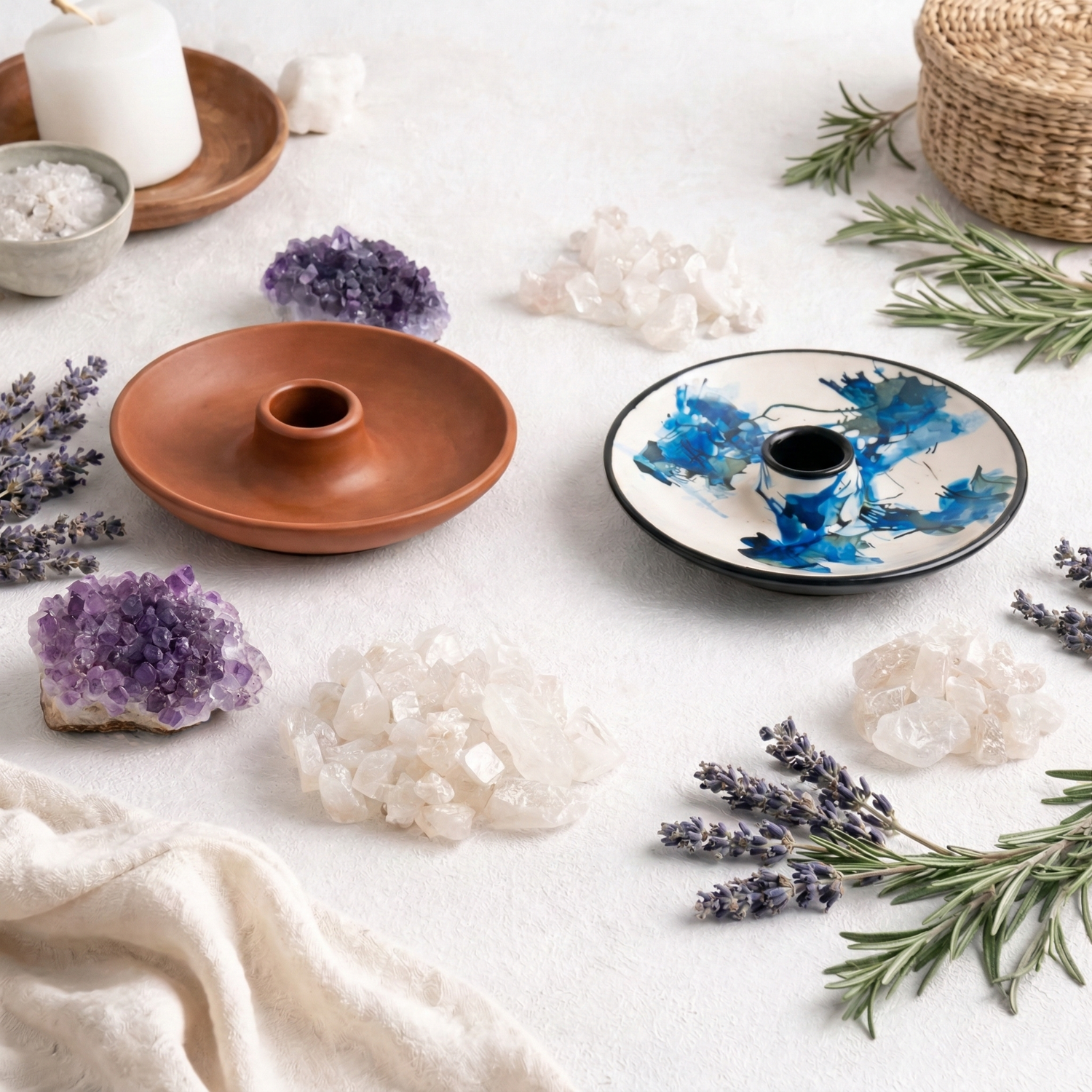 Ceramic Palo Santo holder with Palo Santo stick surrounded by lavender, rosemary, and natural crystals on a white background